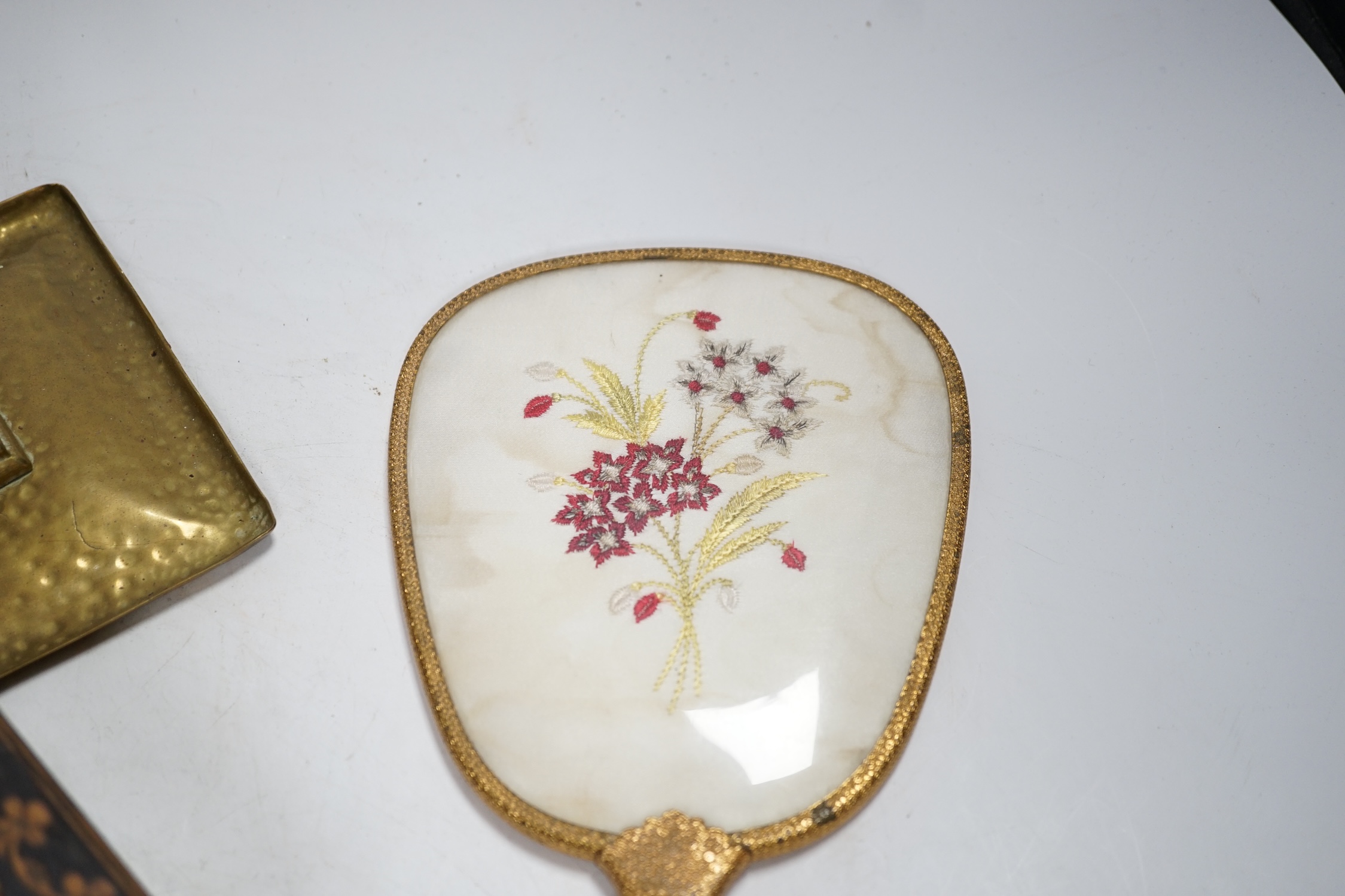 An inlaid Sorrento style box, a gilt hand mirror with enamel cartouche, a pair of brass candle holders and another hand mirror, box 30cm wide